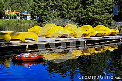 Jet skis at morning on the pier in the port. Catamarans standing in the harbor on the platform Editorial Stock Photo