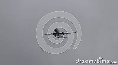 JetBlue Airbus A220 aircraft flying through the sky on a grey cloudy day Editorial Stock Photo