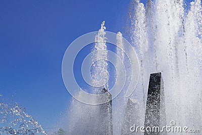 Splashes of fountain water in a sunny day Stock Photo
