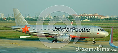 A Jetstar airplane at the Changi airport in Singapore Editorial Stock Photo