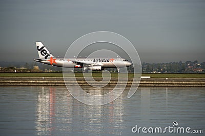 Jetstar passenger jet arrives at Kingsford-Smith airport. Sydney Editorial Stock Photo