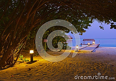 Jetty beach at sunset - Maldives Stock Photo