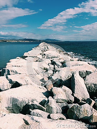 Jetty in California with majestic clouds Stock Photo