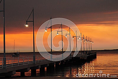 Pier with lights at sunset Perth Rockingham Western Australia Stock Photo