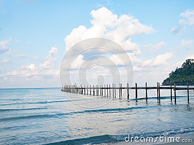 Jetty wooden bridge into blue sea and sky. Pier over water. Vacation And tourism concept. Tropical resort. Jetty on Koh Kood Stock Photo