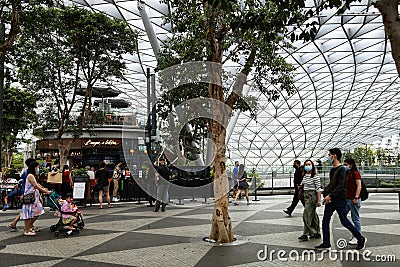 Jewel Changi Airport - Local residents passing by and queuing at restaurant Editorial Stock Photo