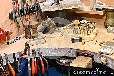 Jeweler`s workplace with a multitude of working tools Stock Photo