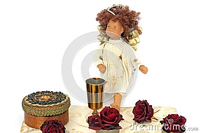 Jewelry boxes, roses, golden bowl and angel on a white background Stock Photo