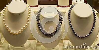 Jewelry items on sale in shop window Stock Photo