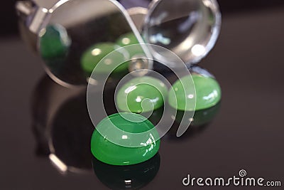 jewelry Real jade, rare, expensive Beautiful green Place on the floor with reflections Stock Photo