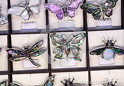 Jewelry retail showcase display different insect form brooches Stock Photo