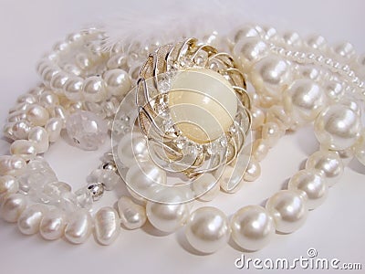 Jewelry, white pearl necklace and brooch Stock Photo