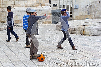 February 2019, Jewish boys yarmulke playing soccer football street, Jewish quarter, Jerusalem Editorial Stock Photo