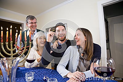 Jewish family celebrating Chanukah Stock Photo