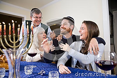 Jewish family celebrating Chanukah Stock Photo