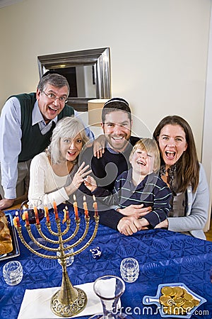 Jewish family celebrating Chanukah Stock Photo