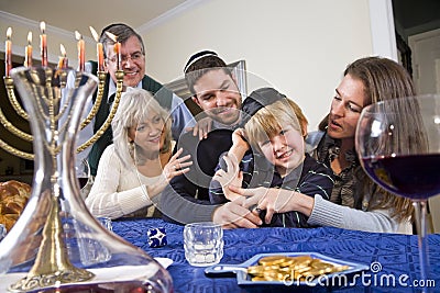 Jewish family celebrating Chanukah Stock Photo