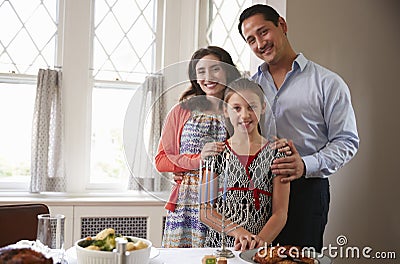 Jewish family smile to camera before Shabbat meal, close up Stock Photo