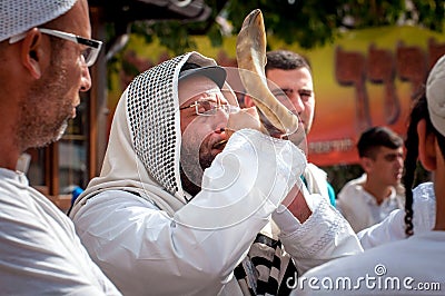 Jewish hasid blows Shofar. Rosh Hashanah, Jewish New Year. Editorial Stock Photo