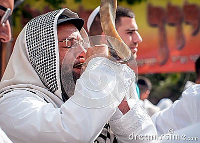 Jewish hasid blows Shofar. Rosh Hashanah, Jewish New Year. Editorial Stock Photo