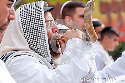 Jewish hasid blows Shofar. Rosh Hashanah, Jewish New Year. Editorial Stock Photo