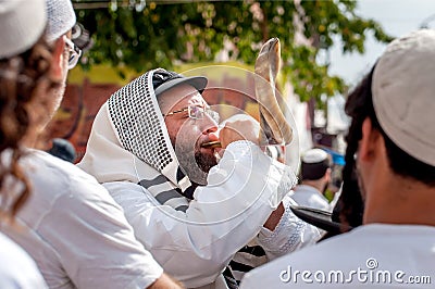 Jewish hasid blows Shofar. Rosh Hashanah, Jewish New Year. Editorial Stock Photo