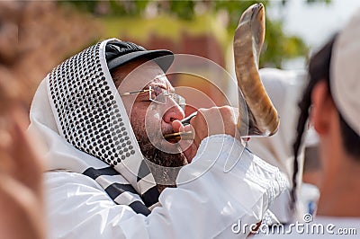 Jewish hasid blows Shofar. Rosh Hashanah, Jewish New Year. Editorial Stock Photo