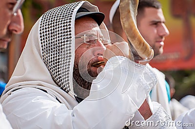 Jewish hasid blows Shofar. Rosh Hashanah, Jewish New Year. Editorial Stock Photo