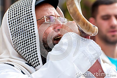 Jewish hasid blows Shofar. Rosh Hashanah, Jewish New Year. Editorial Stock Photo