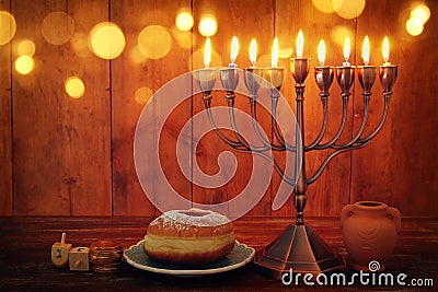 jewish holiday Hanukkah background with traditional spinnig top, menorah & x28;traditional candelabra& x29; and burning candles Stock Photo