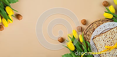 Jewish holiday Passover celebration concept with matzah, seder plate and yellow tulip flowers on modern background. Pesah top view Stock Photo