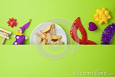 Jewish holiday Purim background with carnival mask and hamantaschen cookies Stock Photo