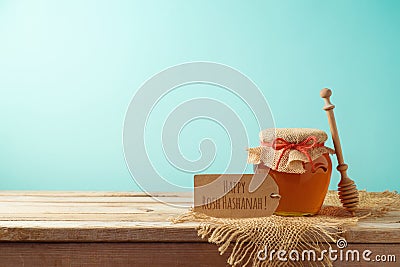 Jewish holiday Rosh Hashanah background with honey jar on wooden Stock Photo