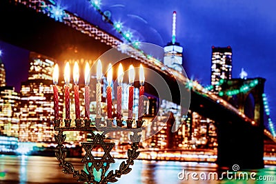 Jewish holiday hannukah symbols menorah, wide view Brooklyn Bridge New York Stock Photo