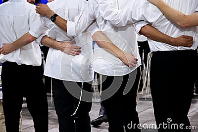 Jewish men celebrate Simchat Torah Stock Photo