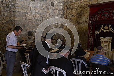 Praying in Wilson`s Arch, the covered section of the Western Wall Editorial Stock Photo