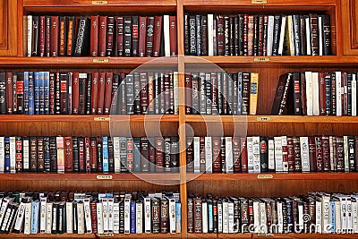 Jewish prayer books on wooden shelves. Editorial Stock Photo