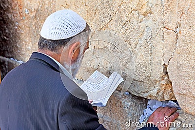 Jewish reading and praying at the western wall Editorial Stock Photo