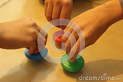 Jewish traditional chanuka toy. Children playing with colorful driedles. Stock Photo