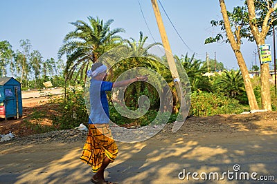 Jhargram, West Bengal, India- April 28, 2018: an old santal an Indian tribe old man was walking and pointing ahead with his Editorial Stock Photo