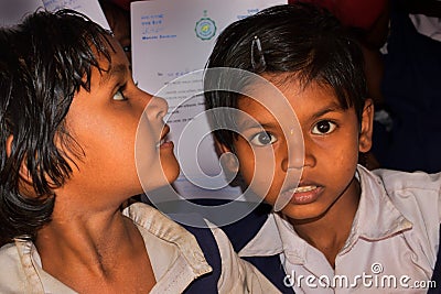 Two school girls from a rural primary school of Bengal, were looking towards the camera lens Editorial Stock Photo