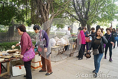 Jiangmen Xinhui, China: street vendors Editorial Stock Photo
