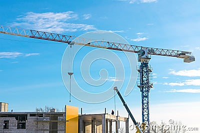 Jib crane. Construction crane against blue sky Editorial Stock Photo