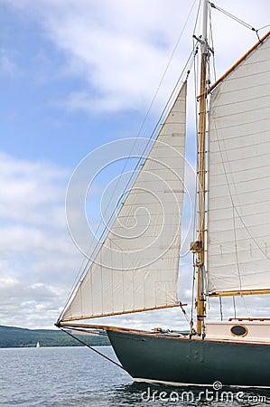 Jib, Foresail and Wooden Mast of Schooner Sailboat Stock Photo