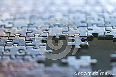 Jigsaw incomplete puzzle missing pieces closeup background Stock Photo