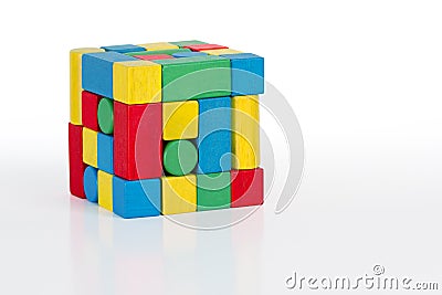 Jigsaw puzzle cube toy, multicolor wooden pieces, colorful game Stock Photo