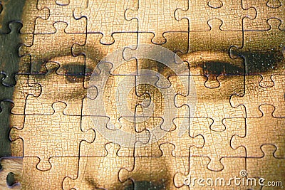 Jigsaw Puzzle Of Female Face Mona Liza La Gioconda from Leonardo Da Vinci, from ancient painting on wooden background Editorial Stock Photo