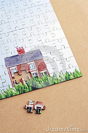 Jigsaw puzzle with house elevated view Stock Photo