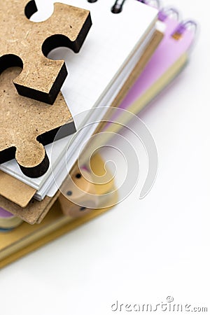 Jigsaw puzzle piece on the stack of books, image use for solving problems, education background concept Stock Photo