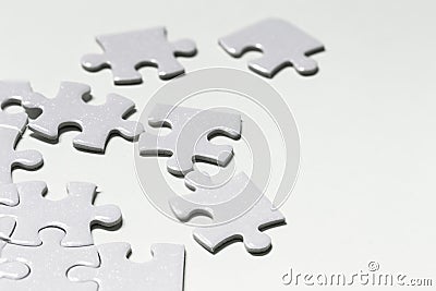 Jigsaw puzzle white piece on white backdrop Stock Photo